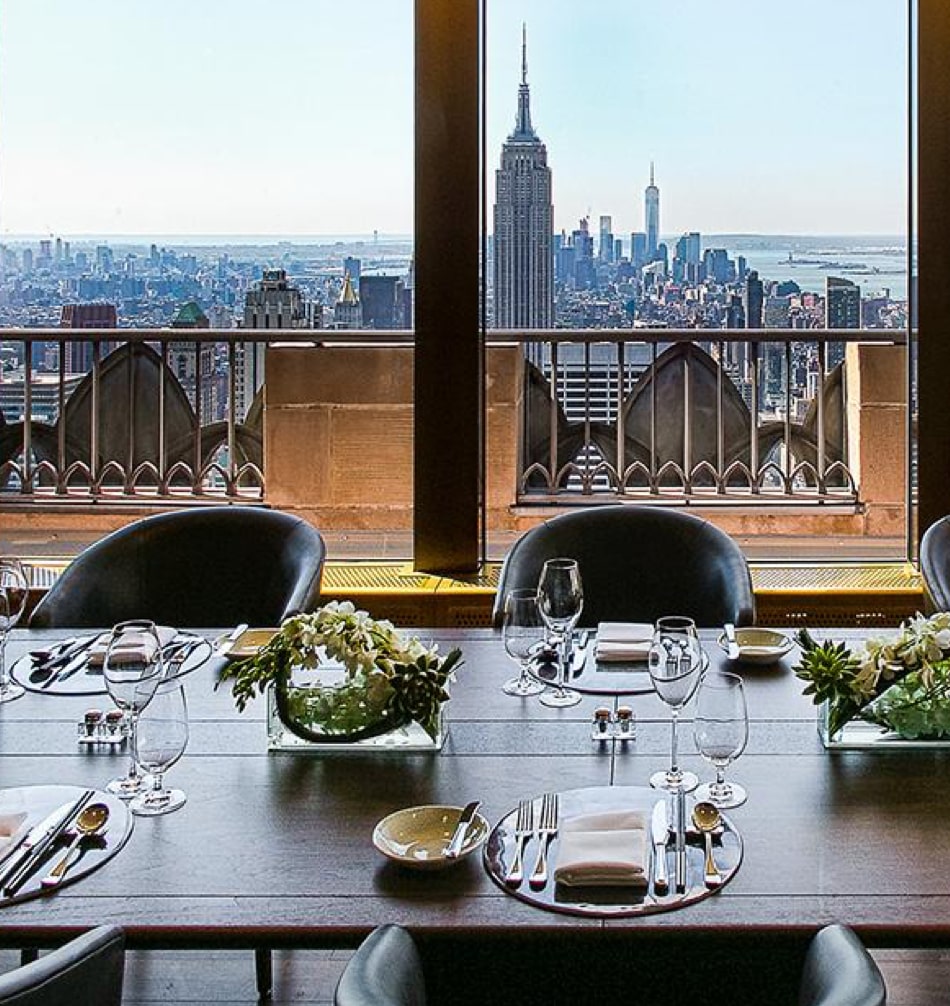 Dining table with views of the Empire State Building and NYC skyline.