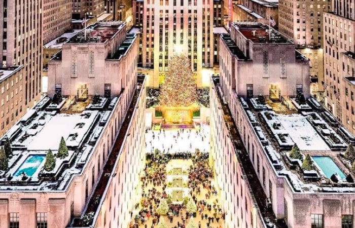 Rockefeller Center Tree and ice skating rink during winter in NYC.